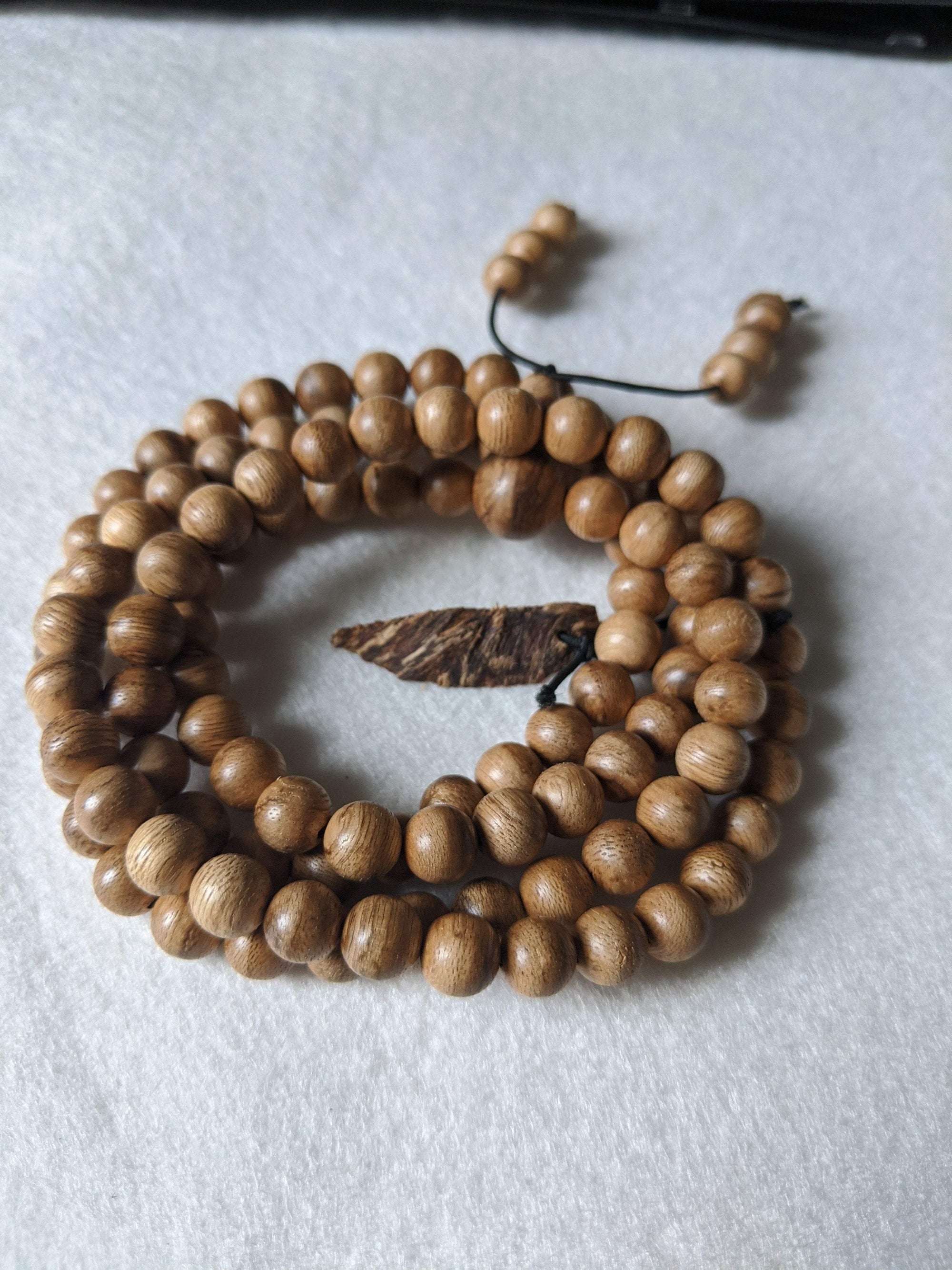 SOLD- 12.5 g, 8mm, Wild Borneo Agarwood 108 mala with a large piece of remaining material -