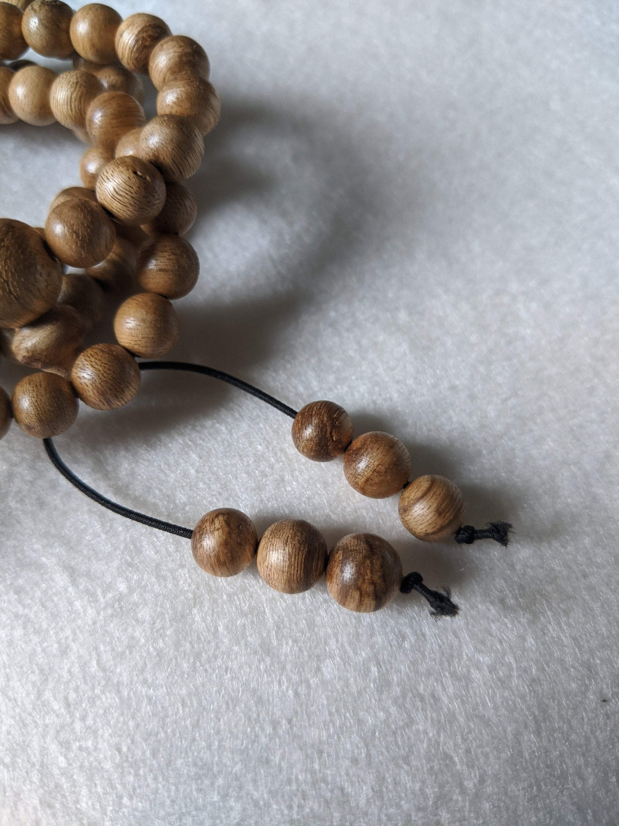 SOLD- 12.5 g, 8mm, Wild Borneo Agarwood 108 mala with a large piece of remaining material -